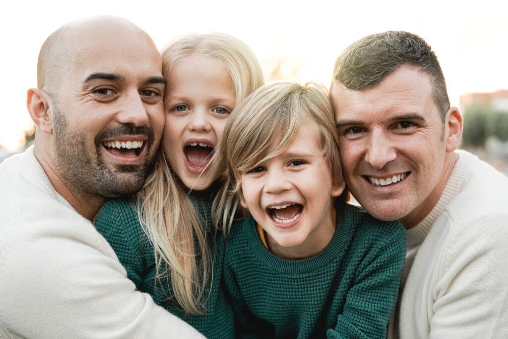 lgbt family outdoor happy gay men couple and son